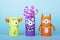 Paper monsters on a blue background. Handmade concept, creative idea from toilet tube