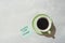 Paper note stick on green coffee mug with text - Enjoy life more