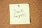 Paper note written with Don`t Forget inscription on cork board