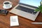 Paper notepad with text Change Password, on a wooden office workspace with laptop, coffee and glasses, security business concept