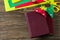 Paper origami bookmark for books a strawberry and an apple on a wooden table.