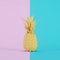Paper pineapple painted in yellow on pink and blue background