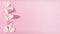 Paper pink hearts on a pink background. Horizontal narrow banner