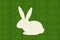 Paper rabbit over green grass