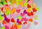 Paper rainbow colors hearts as a pattern for design