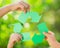 Paper RECYCLE sign in children`s hands