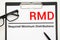 Paper with Required Minimum Distributions RMD on a table