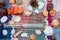 Paper ship, wine bottle, seashells and pebbles on colorful background. Traveling concept. Vacation concept. Colorful flat lay desi