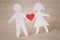 Paper silhouette of children with a heart - childhood love conc