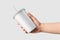 Paper soda cup in a hand with straw mockup template, isolated on light grey background.