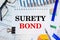 Paper with Surety Bond on a table