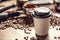 Paper takeaway cup with a plastic lid with a coffee with coffee beans and ground coffee in the background