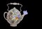 Paper teapot with dried beautiful flowers on black background.