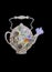 Paper teapot with dried beautiful flowers on black background.