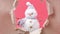 The paper is torn and a snowman appears on a red background. Christmas stop motion animation