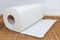Paper towels roll with tear sheets on bamboo table mat