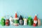 Paper toy Santa, Snowman, Grinch for Xmas party. Easy crafts for kids on blue background, copy space, die creative idea from