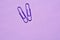 Paperclips isolated on purple background