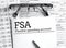 Papers with flexible spending account FSA on a table