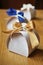 Papery gift box with a golden ribbon on the top