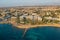 Paphos, Cyprus, aerial panorama of promenade with seaside, hotels and buildings of mediterranean tourist resort. Travel