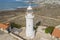 Paphos Lighthouse, Cyprus, aerial view from drone. Located in Paphos archeological park on mediterranean seaside or