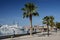 Paphos seafront with palm trees , fisherman and boats on April 20 in Paphos, Cyprus.Paphos -ancient city included in UNESCO list