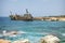 Paphos. Shipwreck. The ship crashed on the coastal rocks at the shore of Mediterranean sea. Tourist attractions of Cyprus