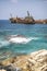Paphos. Shipwreck. The ship crashed on the coastal rocks at the shore of the Mediterranean sea. Tourist attractions of Cyprus
