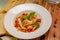 Pappardelle or Linguini pasta in tomato sauce lies on a plate