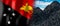 Papua New Guinea - country flag and pile of coal