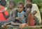 Papuan children outdoors. Asmat people village.