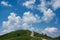 Para glider and two boys hiking on the palanzone mountain and from an alpine trail near the como lake - lombardy italy