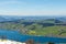 Para plane flying in the Swiss Alps over the lake near Zurich during daylight