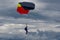 Parachute gliding on dramatic summer sky