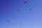 Parachute paragliders enjoy a thermal updraft in Puy de Dome blue sky in Auvergne French Massif Central France