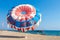 Parachute for parasailing on beach on a sunny summer day