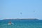 Parachute in the sky above a boat in sea. Entertainment near island in Bulgaria.