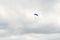 Parachute skydiver flying in clouds, travel adventure concept, s