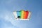 Parachuter, skydiver jumping and skydiving with colorful parachute in rainbow colours on parachuting cup, extreme sport