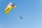 Parachuting above the sea, skydiver