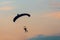 Parachuting sport in sunset sky