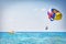 Parachuting in Turkey. Parasailing with boat over sea in Alanya in beautiful summer day. Tropical beach vacation.