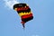 Parachutist with black yellow red parachute on parachuting competition