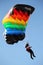 Parachutist with colorful parachute