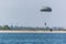 Parachutist Descending into the Lake at an Airshow