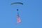 The parachutist glides right and left to display the American flag in all its glory
