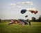 Parachutist landing on field