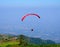 Parachutist with a red parachute