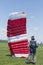 Parachutist running after landing in a field